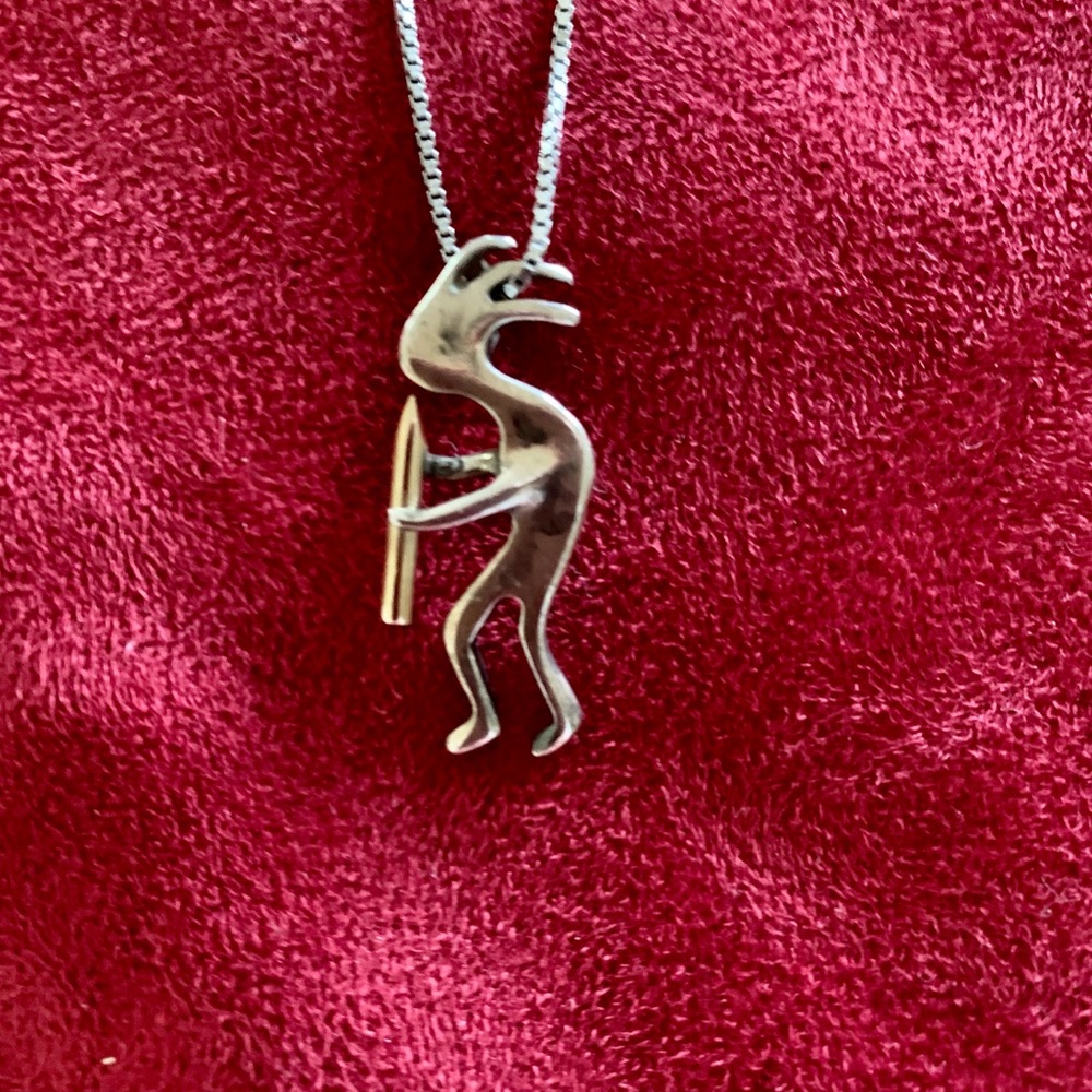 925 Sterling silver Kokopelli with chain.